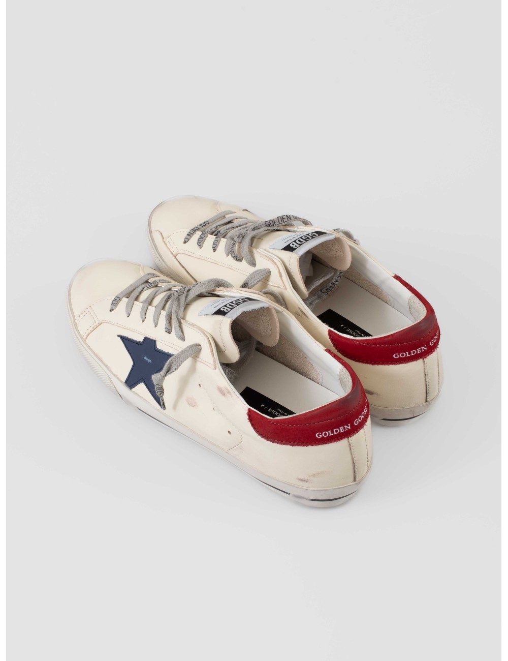 Zapatillas Golden Goose Super-Star blancas con estrella azul y talón rojo hombre - MARFRANC Zapatillas Golden Goose Super-Star blancas con estrella azul y talón rojo hombre - MARFRANC