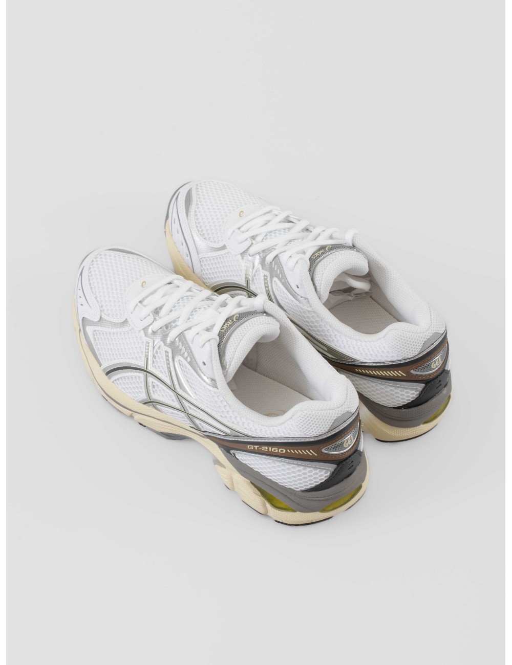 Zapatillas ASICS GT-2160 hombre color White Soft Yellow con amortiguación GEL y diseño retro running disponibles en MARFRANC