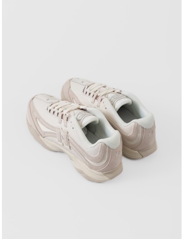 Sneaker timberwolf New Balance RC56 con paneles ondulados, logo N-Lock y base en tonos neutros