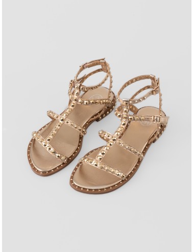 Sandalia plana dorada ASH Precious con tiras cruzadas, hebillas al tobillo y tachas metálicas