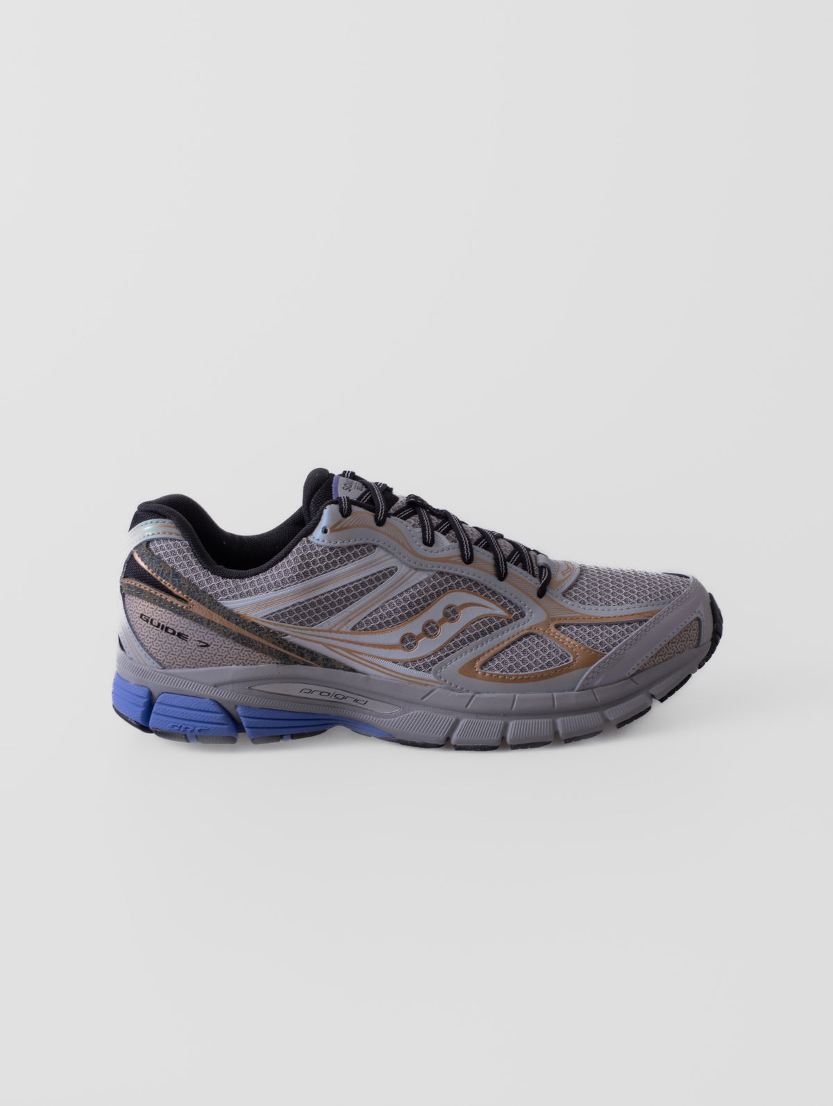 Zapatillas Saucony Daikanyama ProGrid Guide 7 en color OWL/AUREATE, con detalles de su diseño y construcción