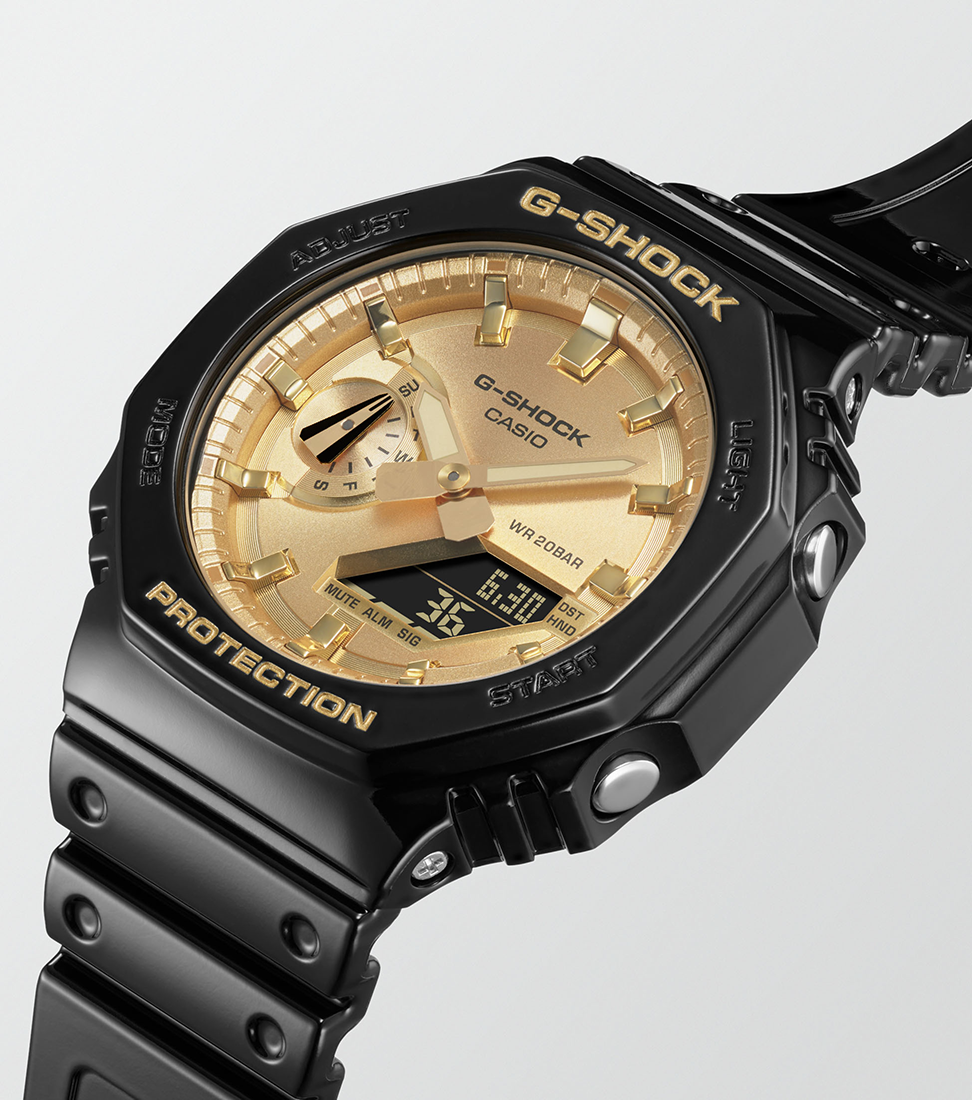 Reloj G-SHOCK negro de caja octogonal y esfera dorada, analógico y digital